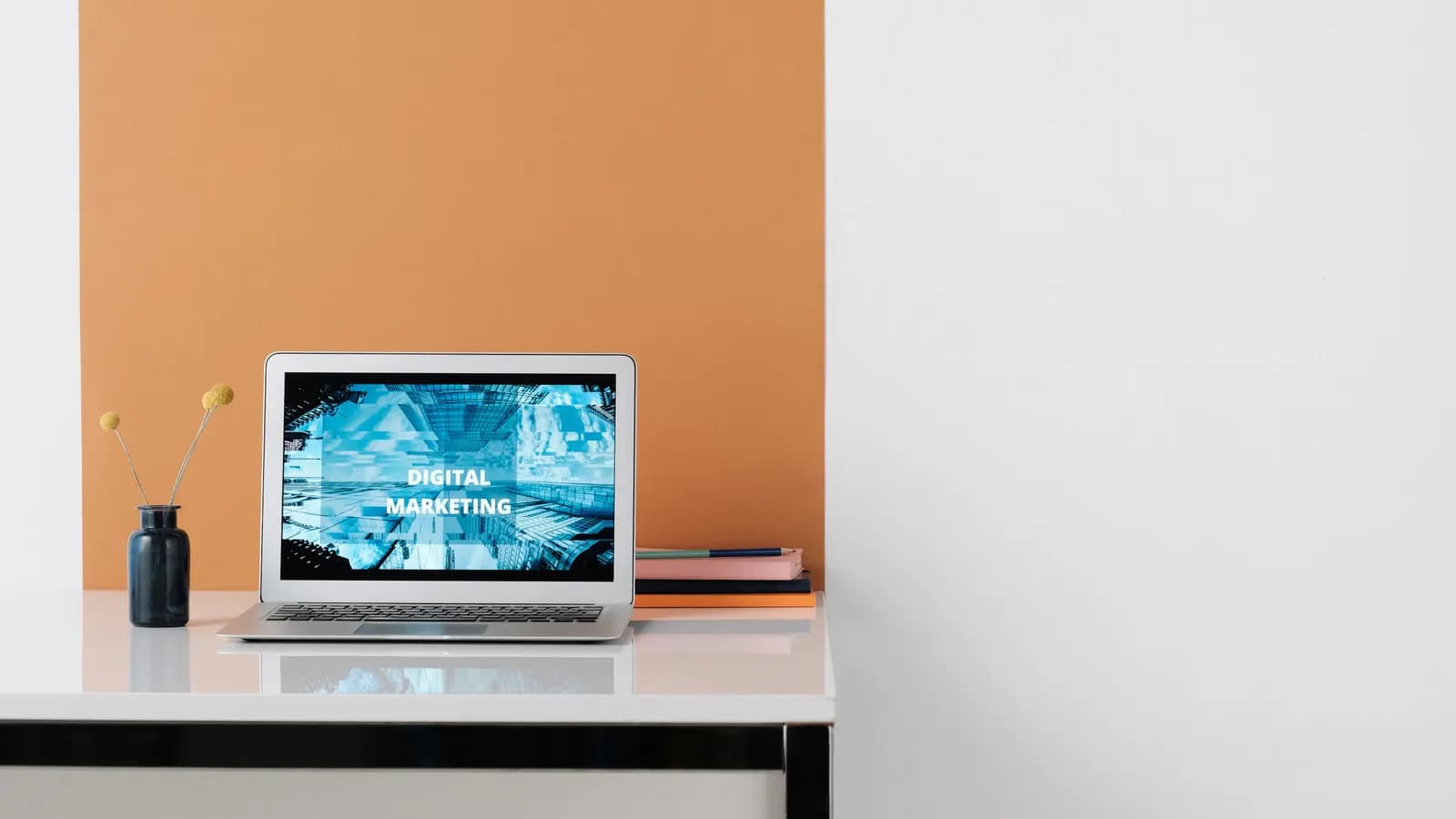 Laptop displaying a marketing website on a clean desk